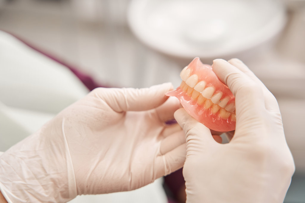 Dental Implants vs. Dentures: Making the Right Choice for Your Lifestyle in New Jersey